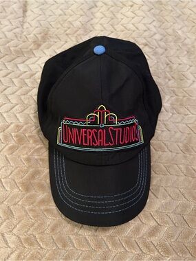Universal Black Baseball Cap with White Text and Red Accent